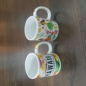Pair of Hawaii coffee mugs, hula girls,  flowers.